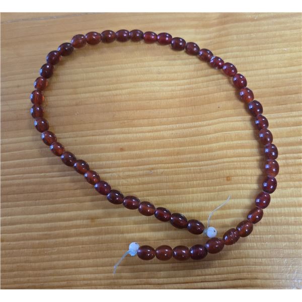 One 16” Antique Translucent  Red Wound Beads