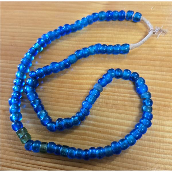 One 24” Strand of Antique Translucent Blue Padre Beads