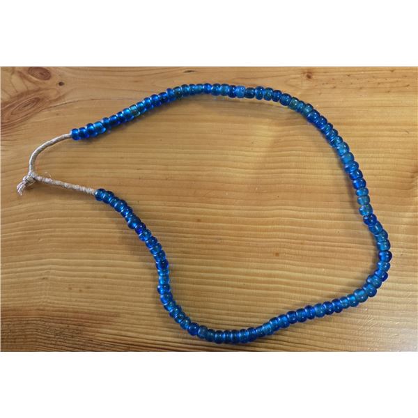 One 23” Strand of Antique Translucent  Blue Padre Beads