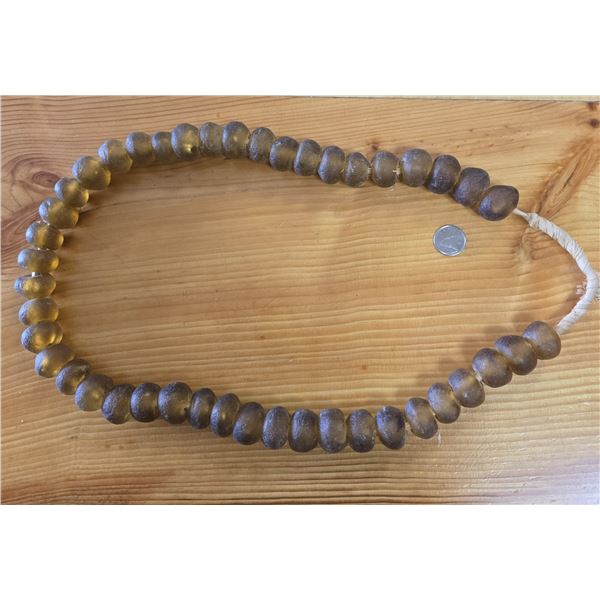 One 27” Strand of Antique Sand Cast Butterscotch Colored Trade Beads