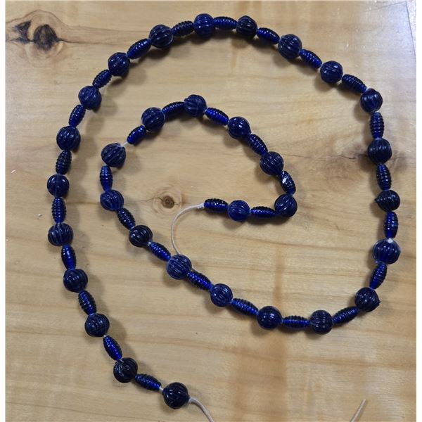 One 34” Strand of Antique Cobalt Blue Wound Melon & Oblong Wound Beads.