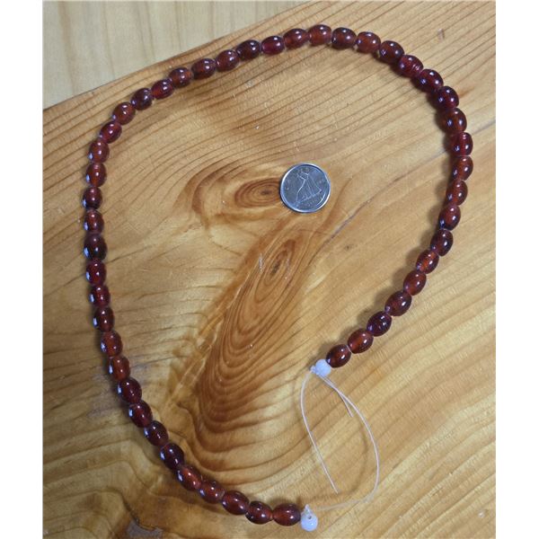 One 16” Antique Translucent  Red Wound Beads