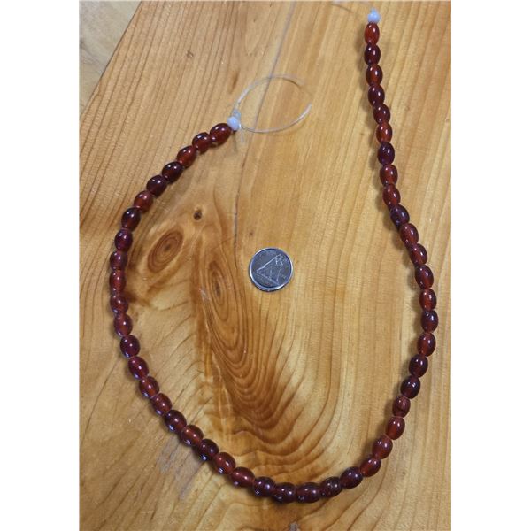 One 16” Antique Translucent  Red Wound Beads