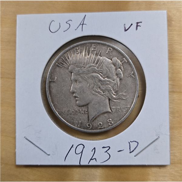 One 1923 American Silver Peace Dollar.