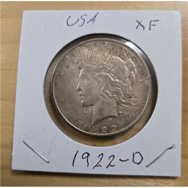 One 1922 American Silver Peace Dollar.