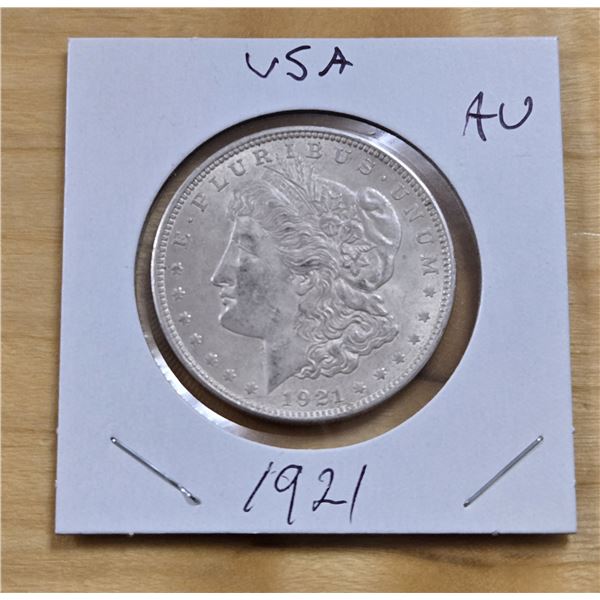 One 1921 American Silver Morgan Dollar.
