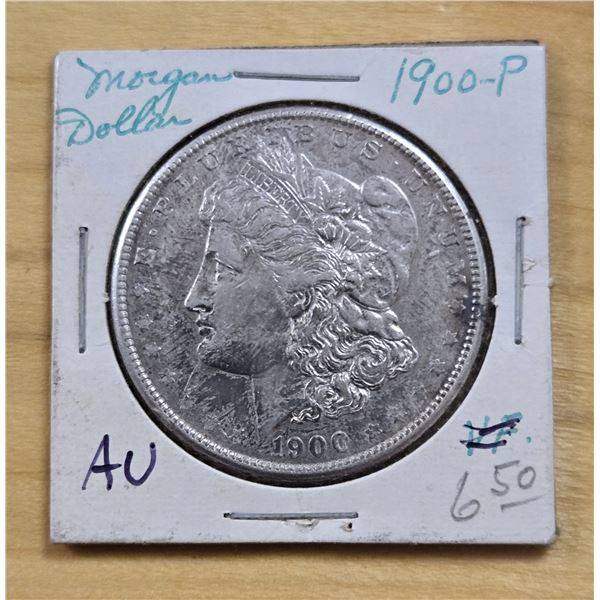 One 1900 American Silver Morgan Dollar.