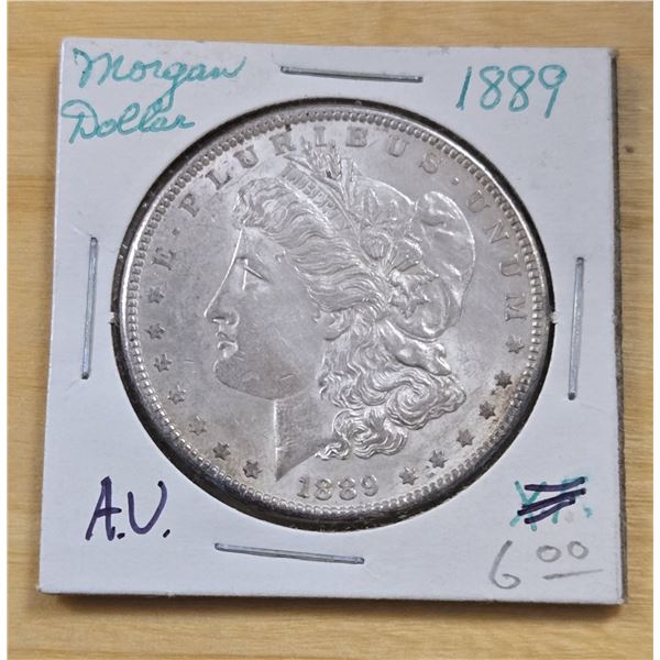 One 1889 American Silver Morgan Dollar.