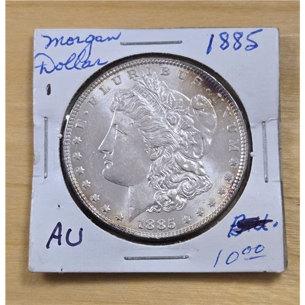 One 1885 American Silver Morgan Dollar.