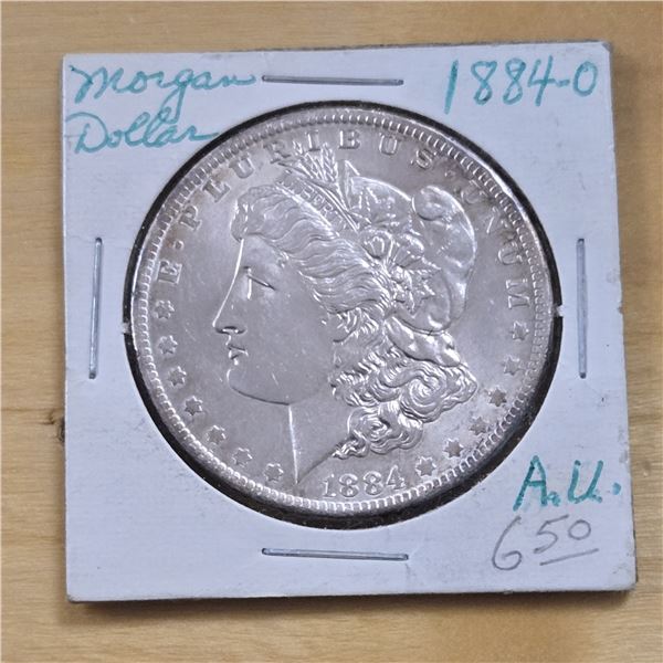 One 1884 American Silver Morgan Dollar.