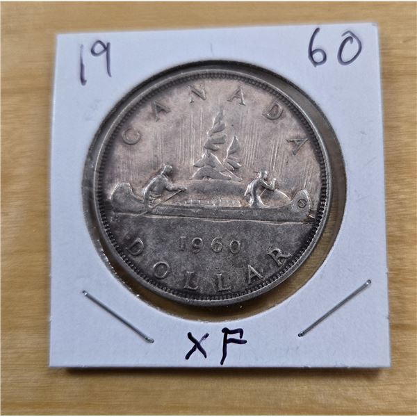 One 1960 Canadian Silver Dollar.