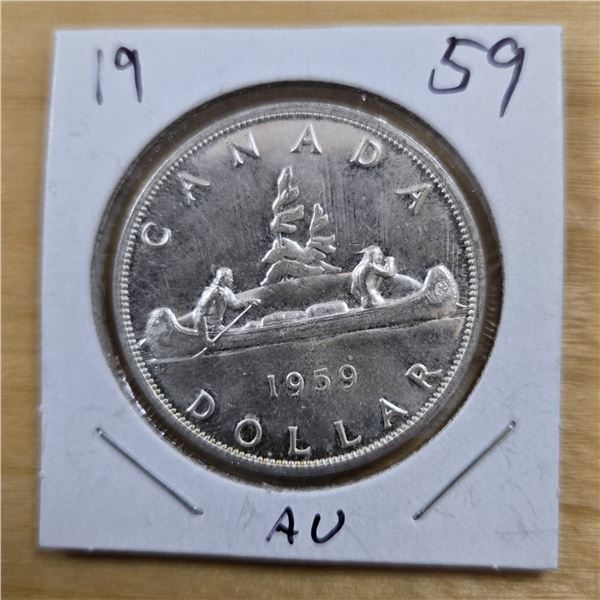 One 1959 Canadian Silver Dollar.