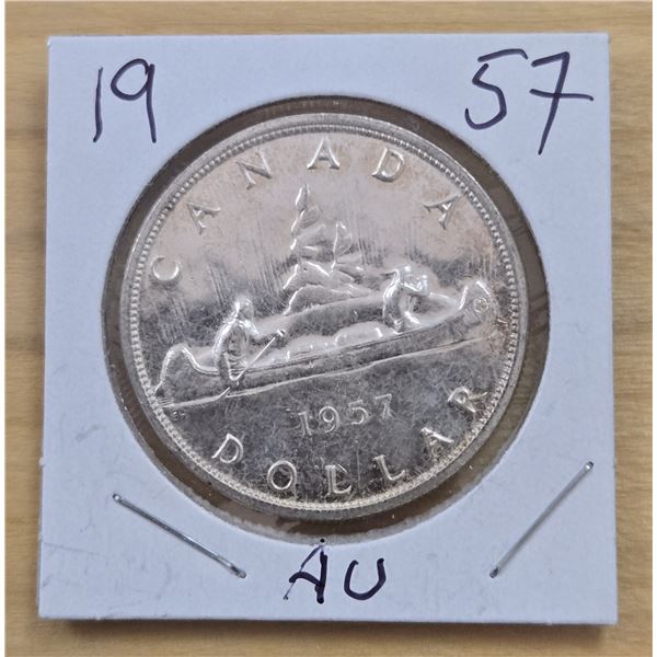 One 1957 Canadian Silver Dollar.
