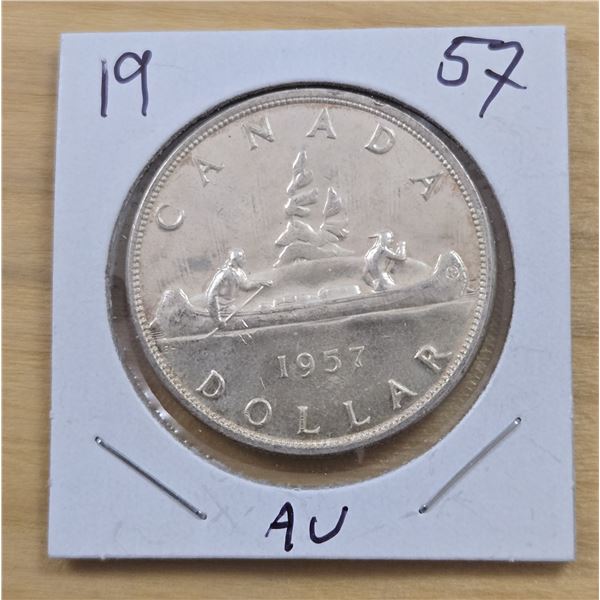 One 1957 Canadian Silver Dollar.