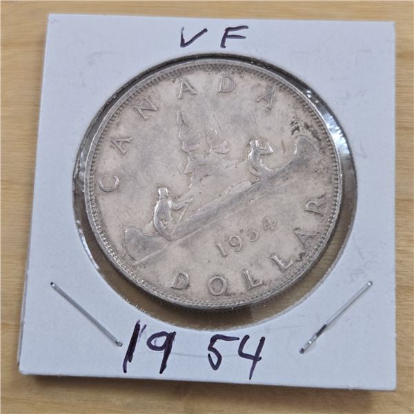 One 1954 Canadian Silver Dollar.