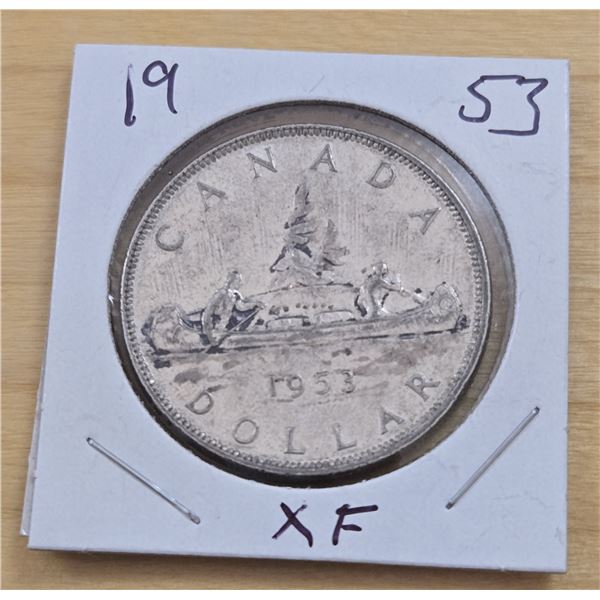 One 1953 Canadian Silver Dollar.