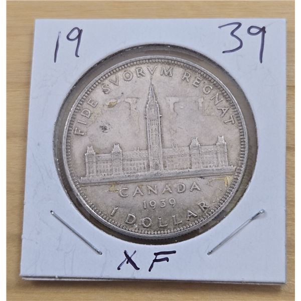 One 1939 Canadian Silver Dollar.
