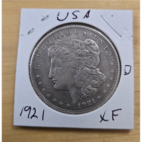 One 1921 American Silver Morgan Dollar.