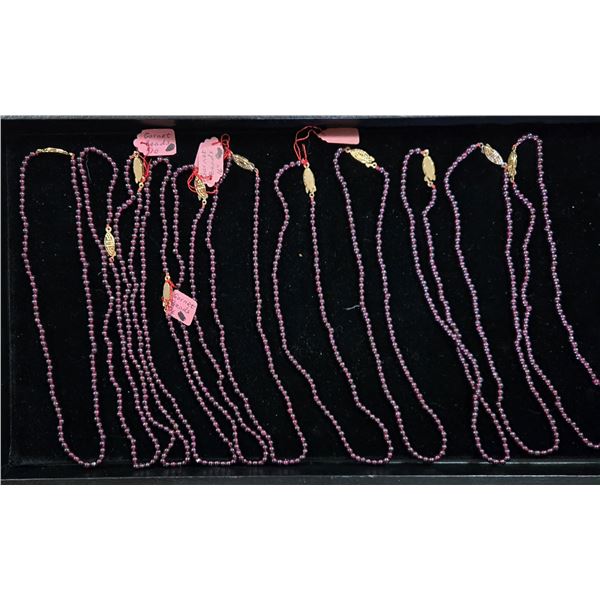 Eleven 16” Strands of Garnet Beads