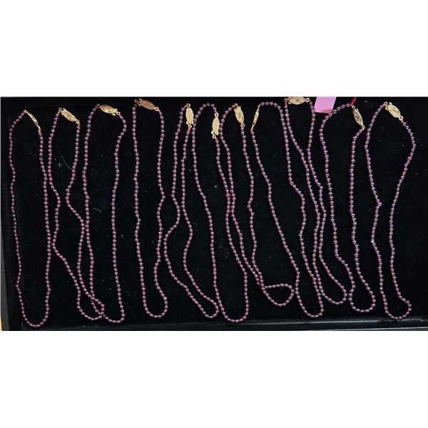 Eleven 16” Strands of Garnet Beads