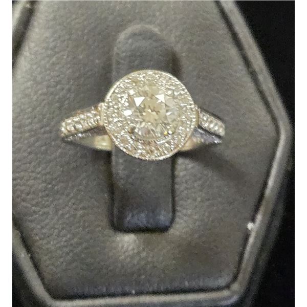 One Ladies 14 Karat White Gold and Diamond Engagement Ring.