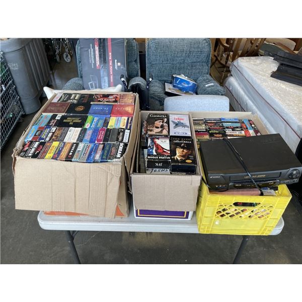 4 BOXES OF VHS TAPES AND PLAYER