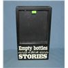 Image 1 : iIlluminated empty bottles are filled with Stories wall mount display