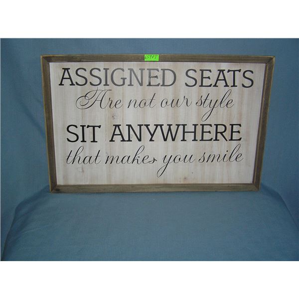 Assigned seats are not our style sit anywhere wood framed advertising sign