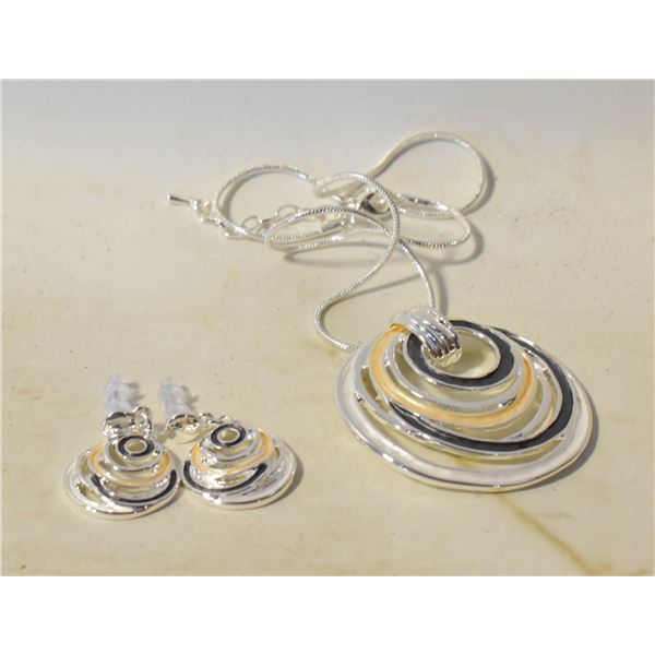 12)  SILVER TONE WITH BLACK, CREAM AND