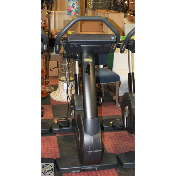 TECHNOGYM STATIONARY SPIN BIKE WITH 15.5" SCREEN