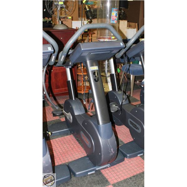 TECHNOGYM STATIONARY SPIN BIKE WITH 15.5" SCREEN