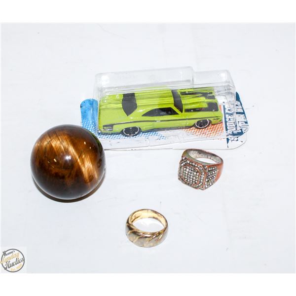 PAIR OF RINGS AND POLISHED ROUND STONE W CAR