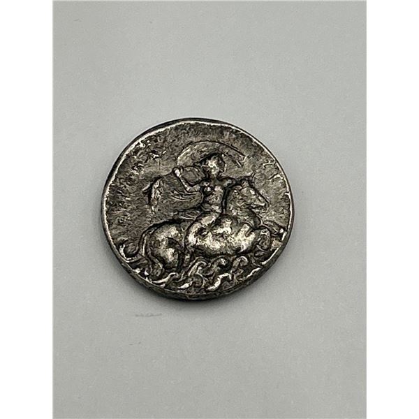 Ancient Coin With Intricate Design Featuring Warrior on Horseback