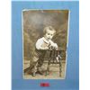 Image 1 : Early photo post card featuring a young boy with toys