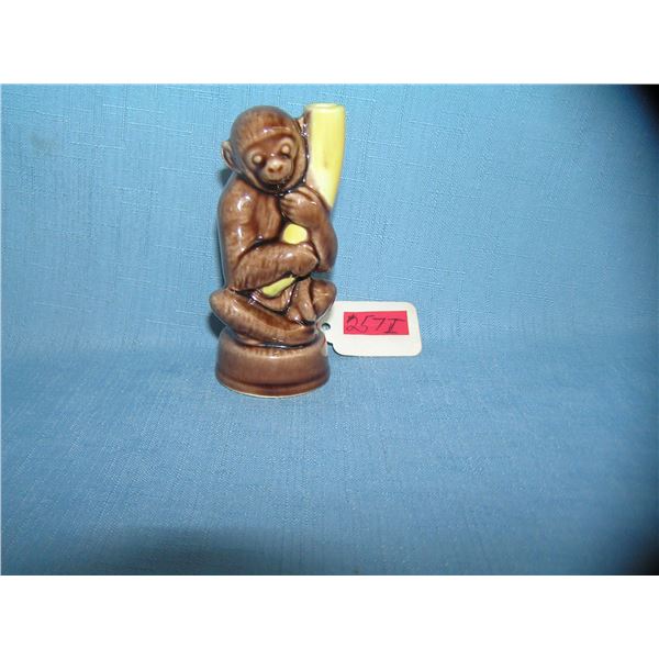 Porcelain glazed monkey and banana figurine