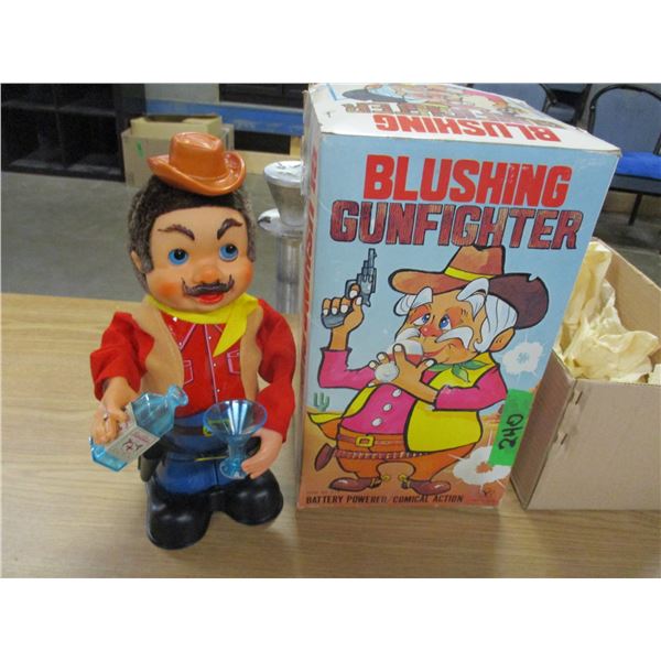 ESTATE:  BATTERY POWERED BLUSHING GUNFIGHTER
