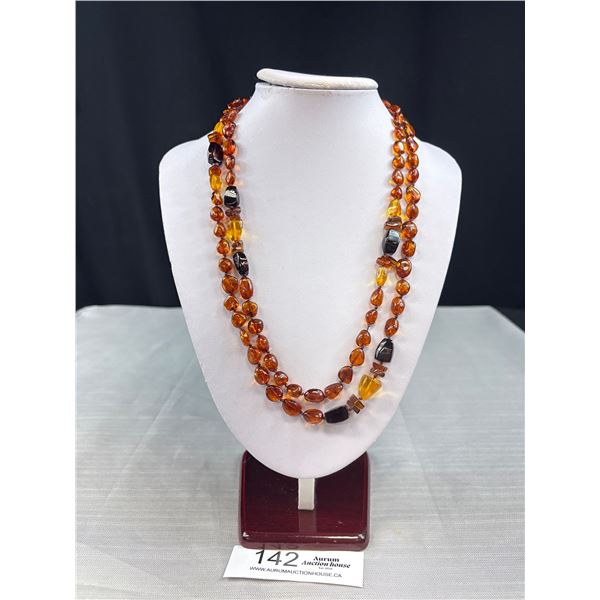 Vintage Hand Knotted Amber Necklace - 46" - 34.6 Grams - Glows Under Black Light
