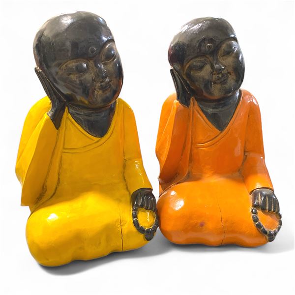 Pair of Monk Statues. Painted in Yellow and Orange robes, with black heads and hands, each holding p
