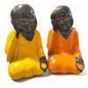 Image 1 : Pair of Monk Statues. Painted in Yellow and Orange robes, with black heads and hands, each holding p