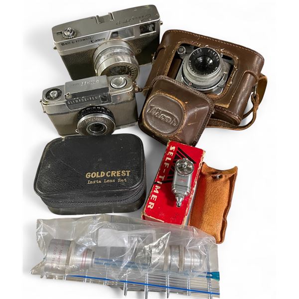 Wacho, Canon, and Olympus-Pen SLR Cameras with Some Accessories