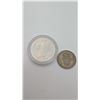 Image 1 : 1980 Percy Williams token and 1958 1 shilling coin.