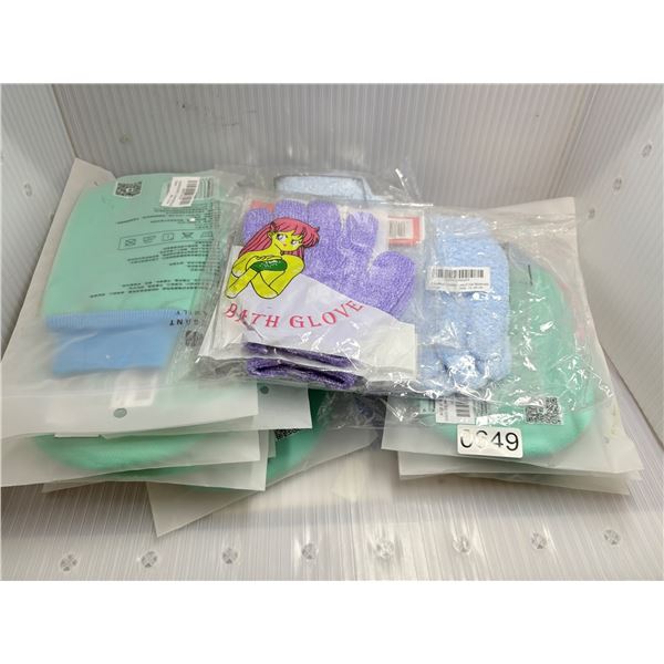 Large group of assorted bath gloves and towels