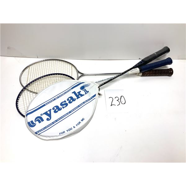 3 racks   Nyasaki badminton racket. It features a classic design with a metallic frame and a dark-co
