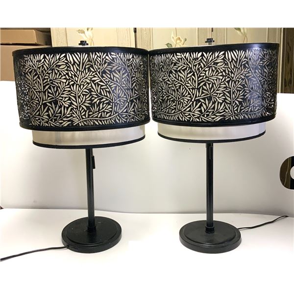 Pair of Shadowflora Table Lamp. Featuring a finely crafted black metal lampshade with intricate bota