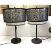 Image 1 : Pair of Shadowflora Table Lamp. Featuring a finely crafted black metal lampshade with intricate bota