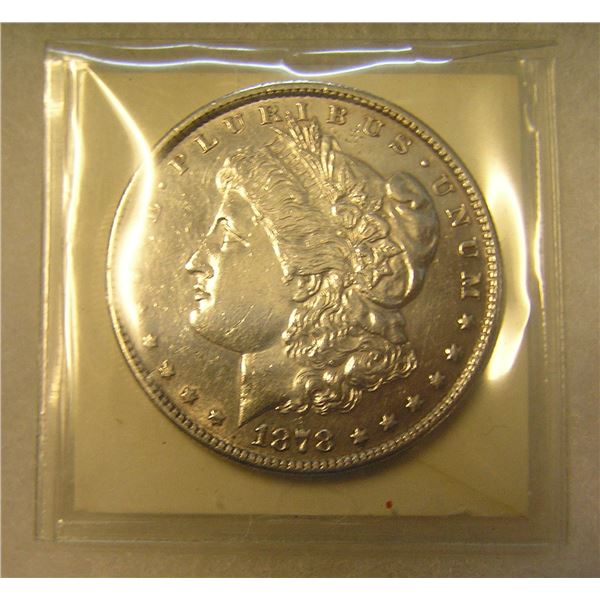 1878S Morgan silver dollar in AU condition