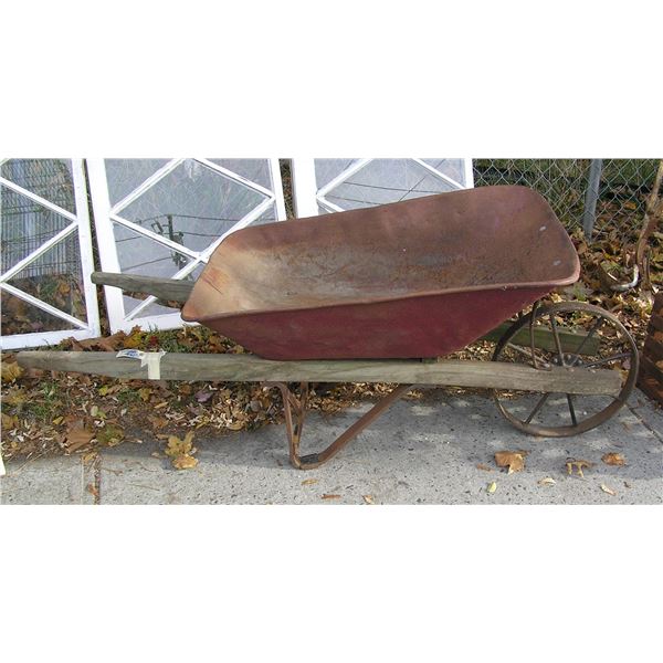 Antique wheel barrow steel and wood construction