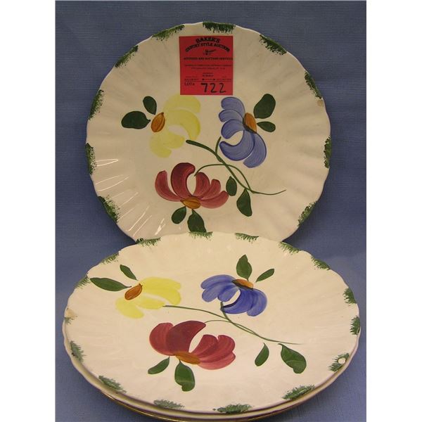 Group of four floral decorated serving plates