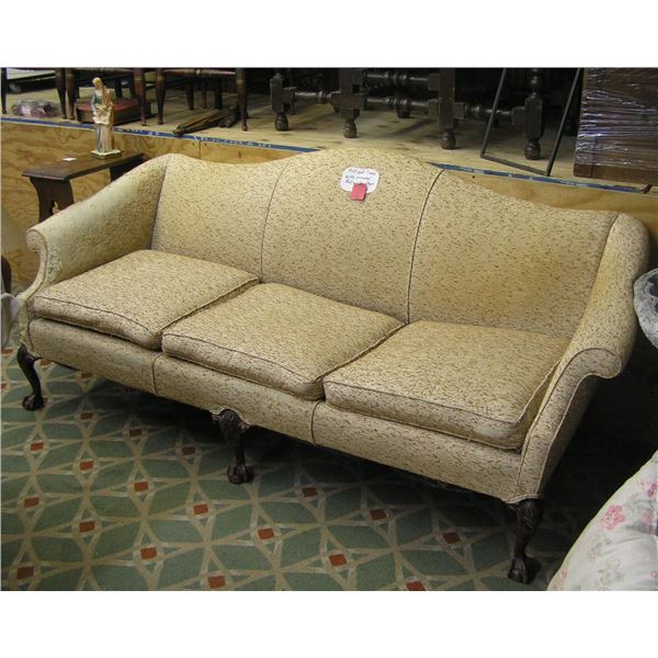 Antique sofa with carved ball and claw feet