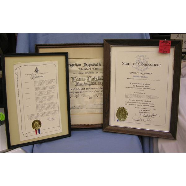 Three framed awards and proclamations